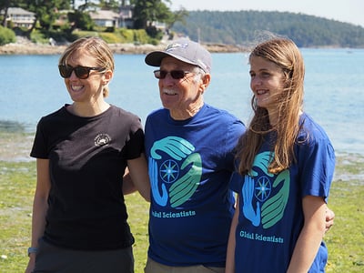 3 generations of volunteers smile at the beach in Victoria