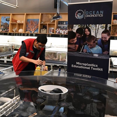 Vancouver Aquarium interpreter shows guests how to use toolkit